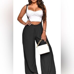 Black Jumpsuit overalls w/ pockets and adjustable tie.